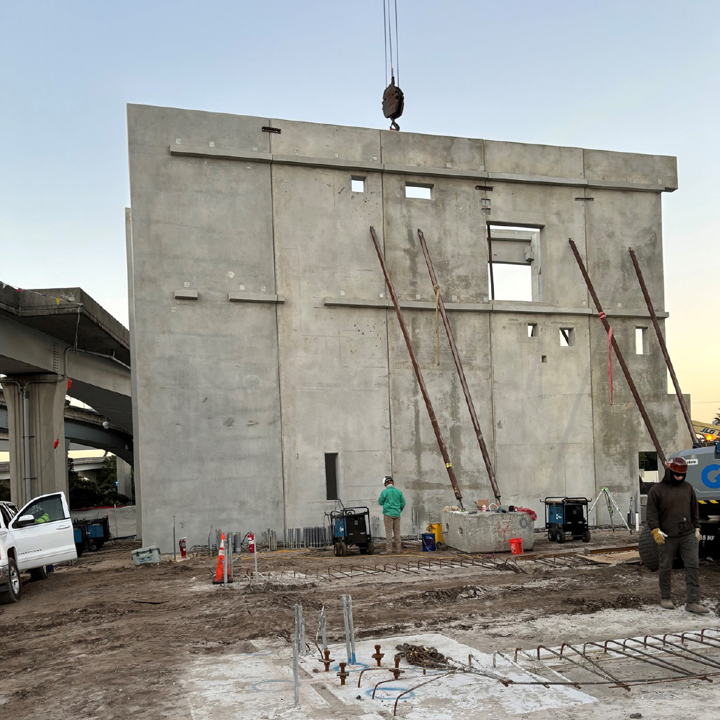 Pre-cast panel being put up during construction