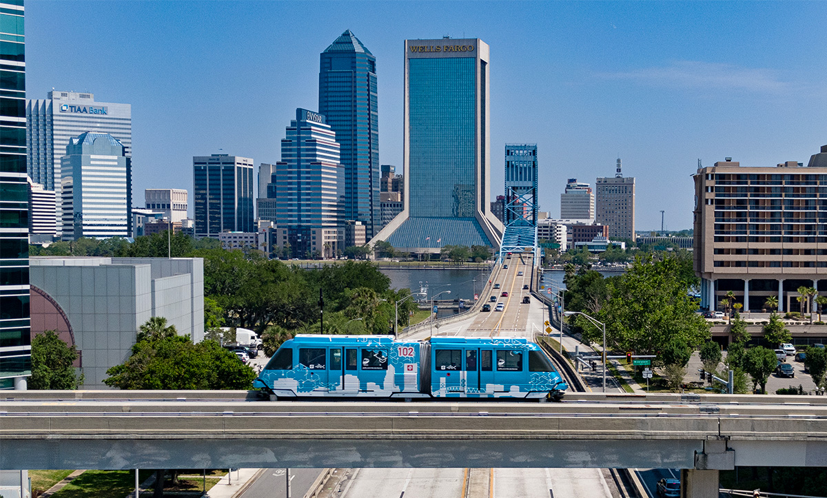 Skyway vehicle in front of the Jacksonville skyline